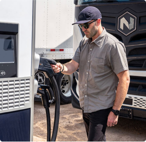 Person charging their electric semi truck