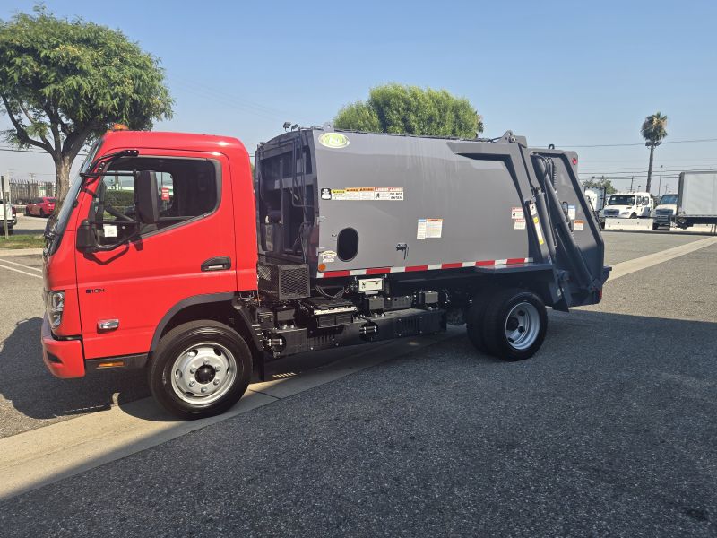 Red cabin trash compactor